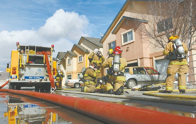Photos by Jim Grant / Nevada AppealCarson City firefighters respond to an apartment fire on Airport road Monday afternoon.