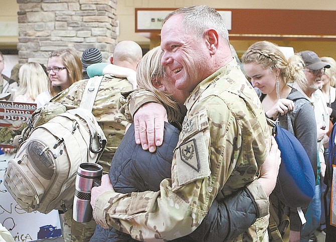 Photos by Shannon Litz / Nevada AppealDan Walters hugs his wife, Sheri, at the Reno-Tahoe International Airport on Wednesday. For more photos go to nevadaappeal.com/photos.