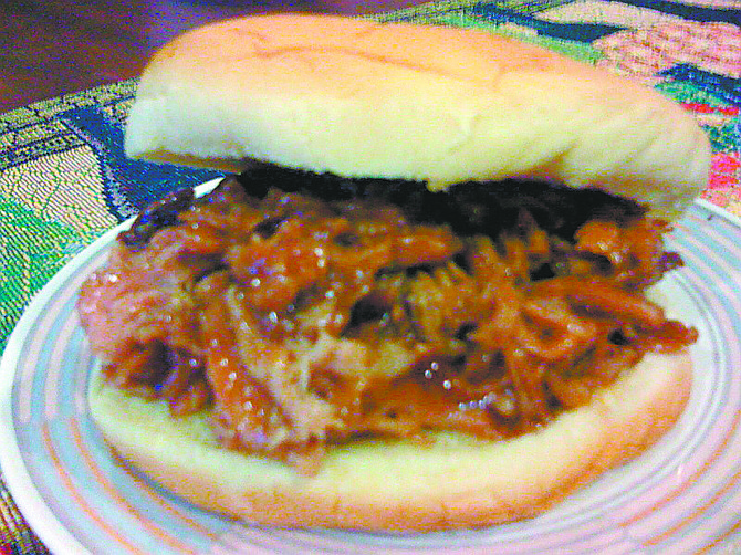 Courtesy David TheissDavid Theiss&#038;#8217; pulled pork takes 16 hours to cook, but it is well worth the wait.