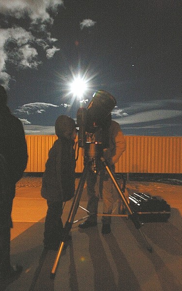 Shannon Litz / Nevada Appeal Visitors look through a telescope at the Western Nevada College observatory. Star Parties are every Saturday at sunset when skies are clear.