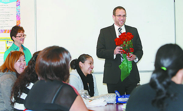 Photos by Jim Grant / Nevada AppealCarson City District Attorney Neil Rombardo visits the Moms Program to pass out roses and thank the women for participating in the program.
