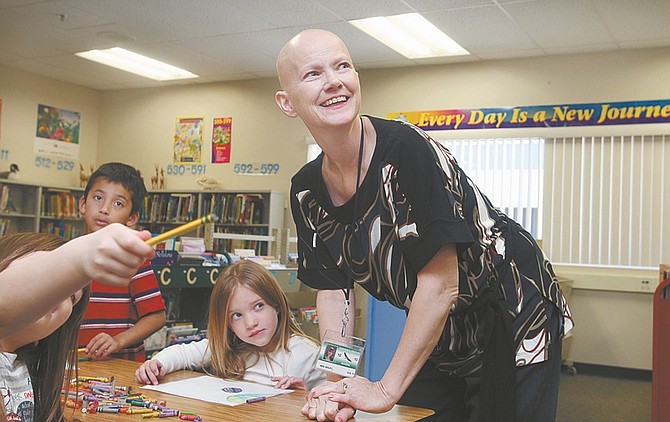 Photos by Jim Grant / Nevada AppealRiverview Elementary School librarian Jennifer Bailey, who is battling stage 4 cancer, works with kindergartners on a project about the moon.