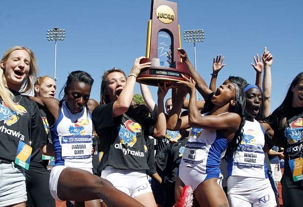 Kansas State women&#039;s track team celebrates after winning the NCAA outdoor track and field championships in Eugene, Ore., Saturday, June 8, 2013. (AP Photo/Don Ryan)