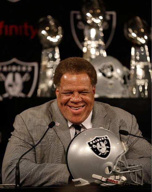 Oakland Raiders general manager Reggie McKenzie smiles during a news conference Thursday, May 8, 2014, at the Raiders&#039; practice facility in Alameda, Calif. The Raiders found the pass rusher they wanted when they selected Buffalo linebacker Khalil Mack with the fifth overall pick in the first round of the NFL draft Thursday night. (AP Photo/Ben Margot)
