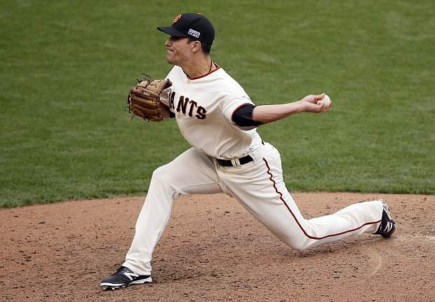 San Francisco Giants relief pitcher Javier Lopez throws against the St. Louis Cardinals during the 10th inning of Game 3 of the National League baseball championship series Tuesday, Oct. 14, 2014, in San Francisco. (AP Photo/Eric Risberg)