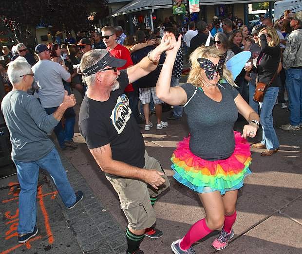 Marty and Nicole Kennedy of Dayton do a little dancing in Telegraph Square Saturday afternoon.