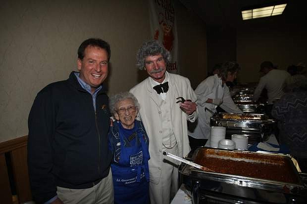 The 31st annual Chili Feed host Lt. Gov. Brian Krolicki and MacAvoy Layne, who portrays Mark Twain, thank 90-year-old Rosemary Smith for her 31 years of volunteer work at the chili feed.