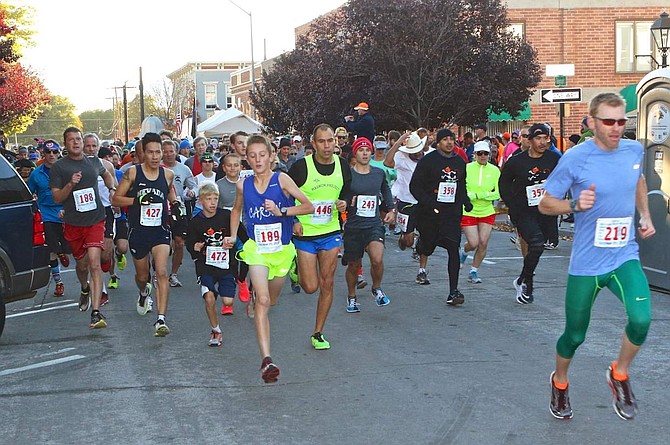 Nevada Day 2-mile and 8k runners leave the starting line Saturday in Telegraph Square.