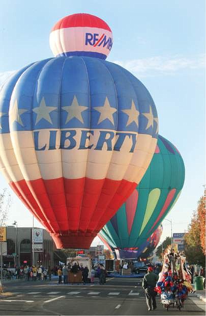 Hot-air balloons line Carson Street during the ReMax/Nevada Day balloon launch on Saturday morning.