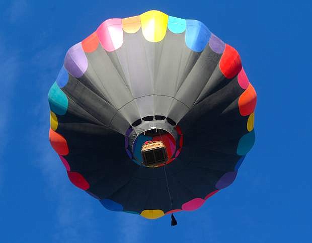 A hot air balloon soars over Carson City on Saturday morning.