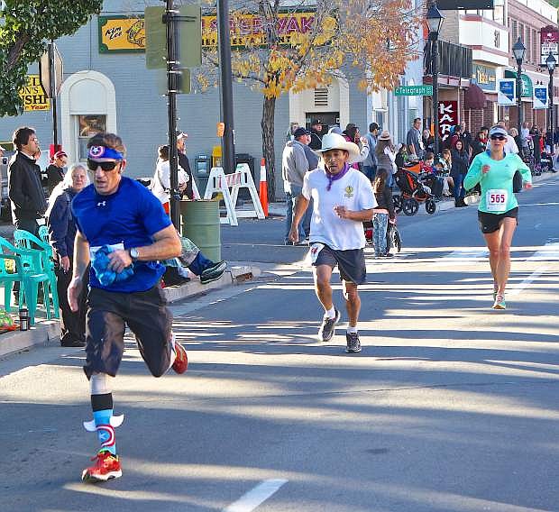 Runners finish the Nevada Day 8k Saturday morning on Carson Street.