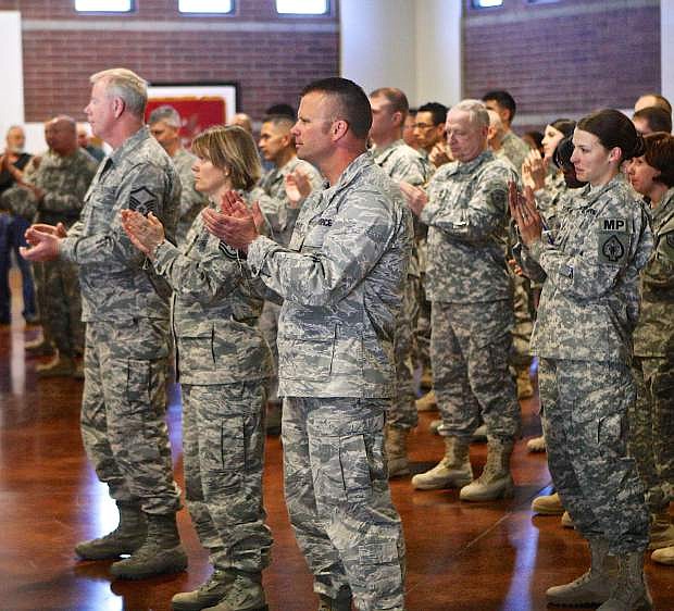 Guardsmen and women applaud Governor Sandovals remarks at the Office of the Adjutant General in Carson City Friday during the Nevada combat veterans tribute wall unveiling Friday morning.