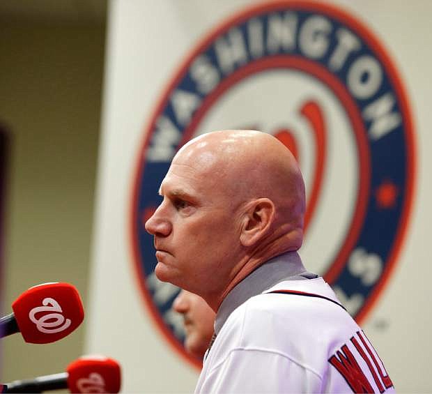 Matt Williams listens to a question after he is introduced as the new manager of the Washington Nationals baseball team during a news conference at Nationals Park, Friday, Nov. 1, 2013, in Washington. (AP Photo/Alex Brandon)