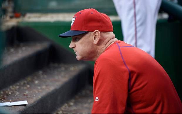 In this photo taken Sept. 26, 2015, Washington Nationals manager Matt Williams watches a baseball game against the Philadelphia Phillies in Washington.  The Washington Nationals say they have fired Matt Williams and his coaching staff. (AP Photo/Nick Wass)