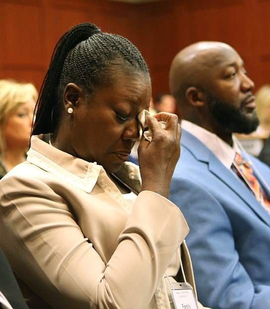 Trayvon Martin&#039;s mother, Sybrina Fulton, left, cries as she listens to the description of her son&#039;s death during opening statements in the George Zimmerman trial, with Trayvon&#039;s father, Tracy Martin, right, in Seminole circuit court, in Sanford, Fla., Monday, June 24, 2013. Zimmerman has been charged with second-degree murder for the 2012 shooting death of Trayvon Martin. (AP Photo/Orlando Sentinel, Joe Burbank, Pool)