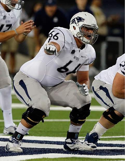 Nevada offensive linesman Kyle Roberts (66) against Arizona during the first half of the NCAA college football game, Friday, Sept. 13, 2014, in Tucson, Ariz. (AP Photo/Rick Scuteri)