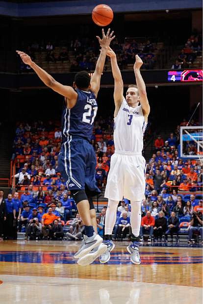 Boise State&#039;s Anthony Drmic (3) shoots over Nevada&#039;s Eric Cooper Jr (21) during the first half of an NCAA college basketball game in Boise, Idaho, on Wednesday, March 2, 2016. (AP Photo/Otto Kitsinger)