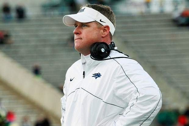 Nevada head coach Brian Polian stands on the slide line during an NCAA college football game against Colorado St in Fort Collins, Colo., on Saturday, Nov. 9, 2013. (AP Photo/David Zalubowski)