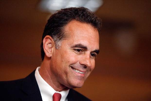 FILE- In this June 8, 2010 file photo, Danny Tarkanian speaks to the media after a primary election in Las Vegas. Tarkanian announced Monday, July 13, 2015, that he&#039;ll run for the 3rd Congressional District seat held by fellow Republican Rep. Joe Heck, setting up a primary with establishment-backed state Sen. Michael Roberson.  (AP Photo/Isaac Brekken, File)