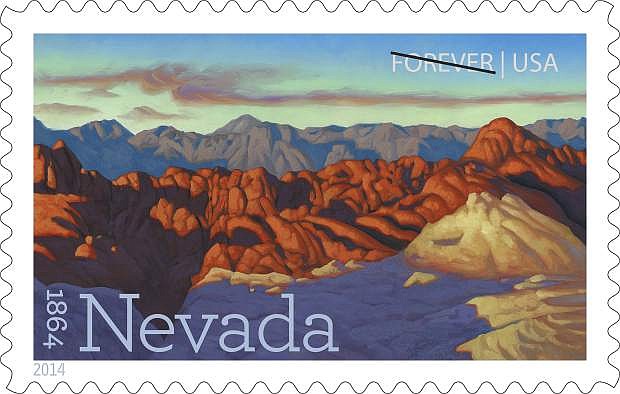 This image provided by the U.S. Postal service shows a new postage stamp commemorating Nevada&#039;s 150th birthday, unveiled Thursday May 29, 2014 in Las Vegas. The design is an oil painting of Fire Canyon, which is part of Valley of Fire State Park in southern Nevada. Reno artist Ron Spears painted the landscape. (AP Photo/US Postal Service)