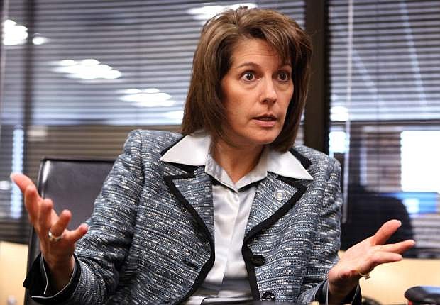 FILE - In this Sept. 24, 2012 file photo, Nevada Attorney Gen. Catherine Cortez Masto speaks to an editorial board at the Las Vegas Sun offices in Henderson, Nev. Masto announced Wednesday, April 8, 2015, that she will run for Harry Reid&#039;s Senate seat in 2016. She says she left her new job as the executive vice chancellor for the Nevada System of Higher Education on Tuesday to launch her campaign. (AP Photo/The Las Vegas Sun, Leila Navidi,File) LAS VEGAS REVIEW-JOURNAL OUT