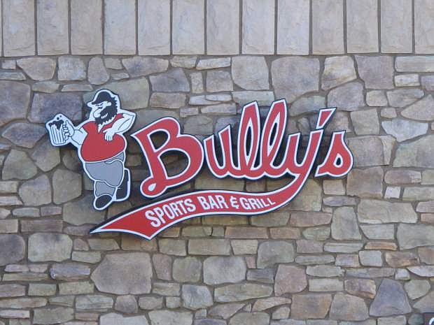 The logo is pictured Tuesday, Feb. 24, 2015, on a Bully&#039;s Sports Bar &amp; Grill iin east Sparks _ one of seven that make up the largest chain of sports bars in northern Nevada. A federal lawsuit filed in U.S. District Court in Reno accuses Bully&#039;s of violating U.S. labor laws by misclassifying cooks and kitchen managers as executives to avoid paying them overtime. Lawyers for both sides filed a motion on Wednesday asking for a case management hearing to be postponed until April 27.  (AP Photo/Scott Sonner)