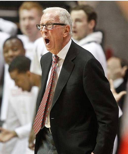 San Diego State coach Steve Fisher gets excited during the second half of a NCAA college basketball game against New Mexico Saturday, March 8, 2014, in San Diego. San Diego State captured the Mountain West Conference regular season championship with a 51-48 victory. (AP Photo/Lenny Ignelzi)