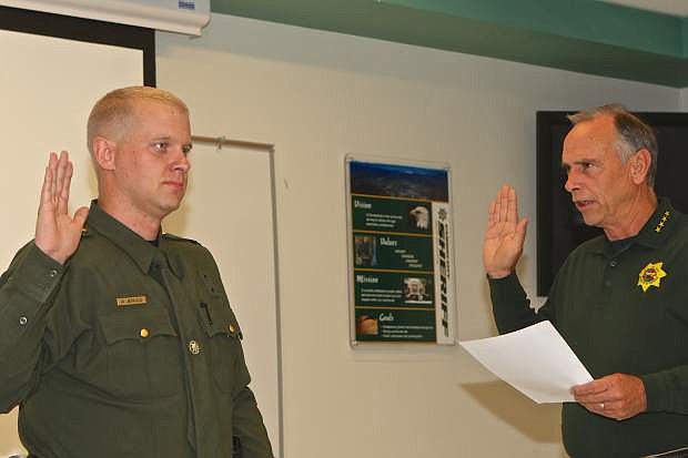 Carson City Sheriff Ken Furlong swears in Deputy Michael Jerauld Friday in the Ormsby Room at CCSO headquarters.