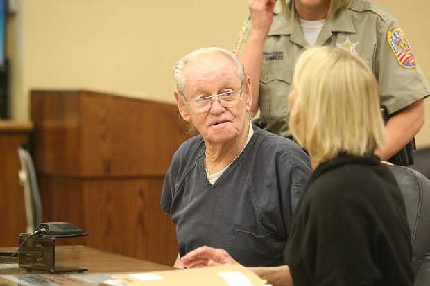 Melvin Norlund confers Friday with his attorney, Kris Brown, in East Fork Justice Court. Norlund, 81, is facing a charge of open murder. He is being held in Douglas County Jail.