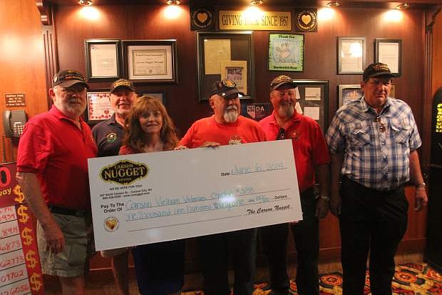 Star Anderson, general manager of the Carson Nugget, presents a $1,131.80 check to Vietnam Veterans of America Carson Area Chapter 388 on Friday. Pictured from left, are Verne Horton, Roger Diez, Anderson, Vietnam Veterans Chapter President Frank Reynolds, Chapter Vice President Tom Spencer and Daniel Walker.