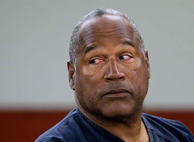 FILE - This May 13, 2013 file photo shows O.J. Simpson during an evidentiary hearing in Clark County District Court in Las Vegas. Simpson&#039;s lawyers submitted a supersized appeal May 21, 2014, asking the Nevada Supreme Court for a new trial in his 2007 Las Vegas armed robbery case. (AP Photo/Julie Jacobson, Pool, file)