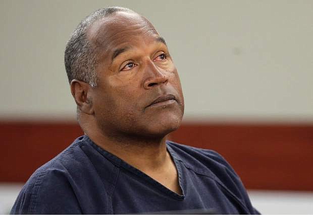 FILE - This May 13, 2013 file photo shows O.J. Simpson listening to testimony at an evidentiary hearing in Clark County District Court in Las Vegas. A judge in Las Vegas rejected O.J. Simpson&#039;s bid for a new trial on Tuesday, Nov. 26, 2013, dashing the former football star&#039;s bid for freedom based on the claim that his original lawyer botched his armed robbery and kidnapping trial in Las Vegas more than five years ago. &quot;All grounds in the petition lack merit and, consequently, are denied,&quot; Clark County District Judge Linda Marie Bell said. (AP Photo/Julie Jacobson, Pool, File)