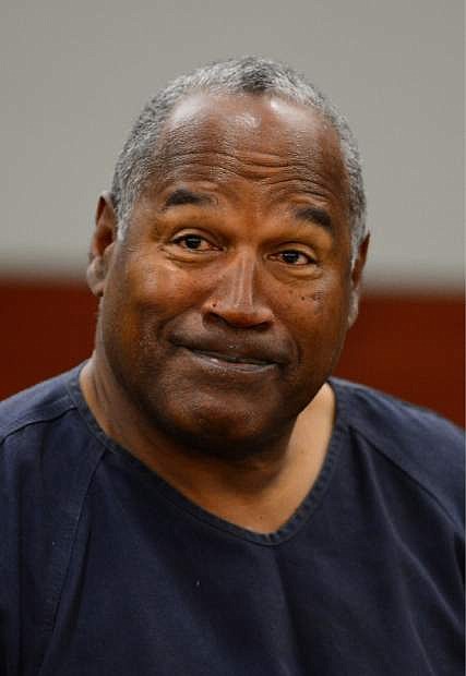 O. J. Simpson appears for the second day of an evidentiary hearing in Clark County District Court, Tuesday, May 14, 2013 in Las Vegas.  The hearing is aimed at proving Simpson&#039;s trial lawyer, Yale Galanter,  had conflicted interests and shouldn&#039;t have handled Simpson&#039;s case. Simpson is serving nine to 33 years in prison for his 2008 conviction in the armed robbery of two sports memorabilia dealers in a Las Vegas hotel room. (AP Photo/Ethan Miller, Pool)