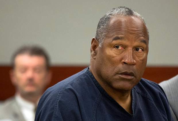 FILE - In this May 16, 2013, file photo, O.J. Simpson listens during an evidentiary hearing in Clark County District Court, in Las Vegas. A judge in Las Vegas rejected Simpson&#039;s bid for a new trial on Tuesday, Nov. 26, 2013, dashing the former football star&#039;s bid for freedom based on the claim that his original lawyer botched his armed robbery and kidnapping trial in Las Vegas more than five years ago. (AP Photo/Julie Jacobson, Pool, File)