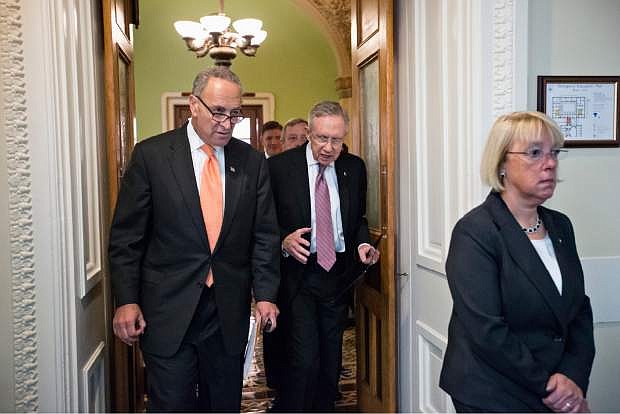 From left, Sen. Charles Schumer, D-N.Y., Senate Majority Leader Harry Reid of Nev., and Senate Budget Committee Chair Sen. Patty Murray, D-Wash., walk to a news conference on Capitol Hill in Washington, Wednesday, Oct. 2, 2013,  to announce to reporters that President Barack Obama has invited the top leaders in Congress to meet with him at the White House to seek a solution to the government shutdown crisis. A funding cutoff for much of the government began Tuesday as a Republican effort to kill or delay the nation&#039;s health care law stalled action on a short-term, traditionally routine spending bill. Lawmakers in both parties have ominously suggested the partial shutdown might last for weeks. (AP Photo/J. Scott Applewhite)