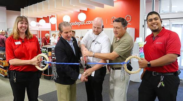 Taking part in a ribbon cutting ceremony at Office Depot on Tuesday are, from left, Carey Blakeley, Mayor Bob Crowell, Brad Nicholos, Assemblyman PK O&#039;Neill and Rogelio Garcia.
