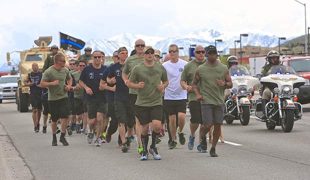 CCSO deputies make their way north on Carson St. Wednesday during the Peace Officer&#039;s Memorial Run.