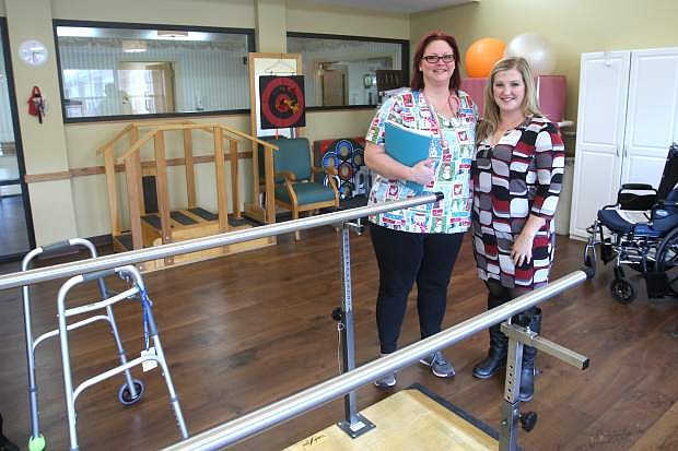 Jillian Speegle, right, community relations director for Ormsby Post Acute Rehab and registered nurse Karri Montgomery pose in the center&#039;s new physical therapy room.