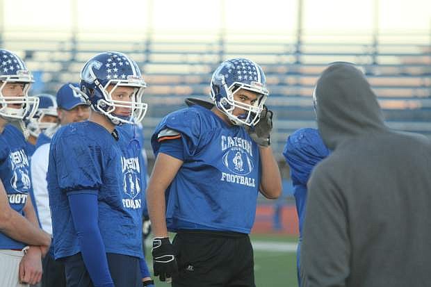 Lineman Josue Orozco listens to instructions from head coach Blair Roman at practice on Monday.