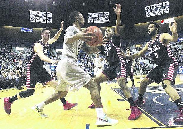 Nevada guard D.J. Fenner (15), seen here playing against Eastern Kentucky University in March, and his Wolf Pack teammates will be on TV at least 19 times this season.