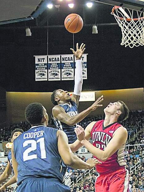 Nevada&#039;s Marqueze Coleman takes the ball to the hoop against UNLV Saturday, Jan. 24, at Lawlor Events Center