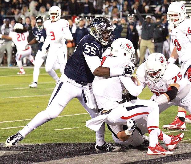 Nevada&#039;s Rykeem Yates sacks Fresno State quarterback Brian Burrell in Saturday night&#039;s loss to the Bulldogs. The Wolf Pack square off against in-state rival UNLV on Saturday in Las Vegas for the Freemont Cannon.