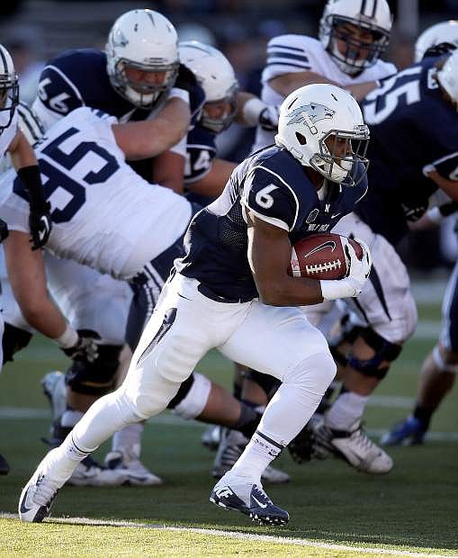 Nevada&#039;s Don Jackson (6) runs against BYU during the second half of an NCAA college football game in Reno, Nev., on Saturday, Nov. 30, 2013. BYU won 28-23. (AP Photo/Cathleen Allison)