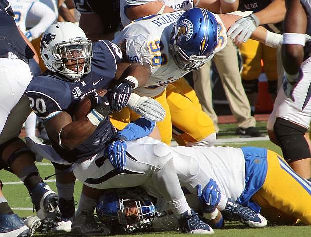 James Butler fights for yardage for Nevada Saturday.