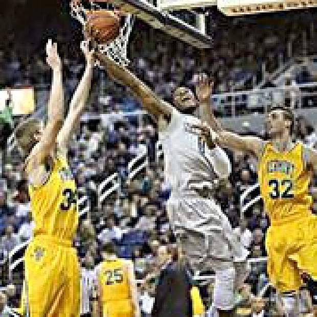 Cameron Oliver goes up for a shot against Vermont Wednesday at Lawlor Events Center.