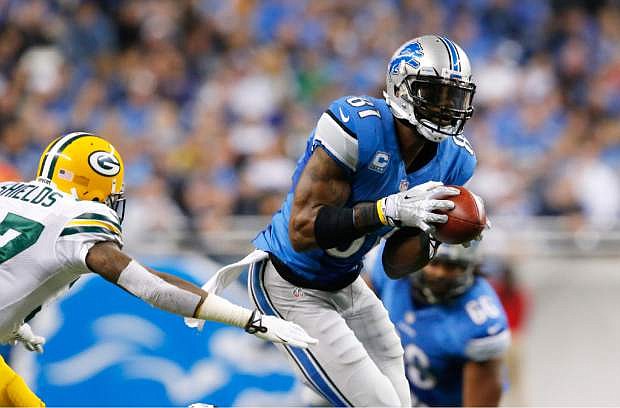 Detroit Lions wide receiver Calvin Johnson (81) pulls away form Green Bay Packers cornerback Sam Shields (37) for a touchdown during the third quarter of an NFL football game at Ford Field in Detroit, Thursday, Nov. 28, 2013. (AP Photo/Paul Sancya)