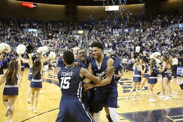 D.J. Fenner celebrates with Elijah Foster after Nevada beat Morehead State for the College Basketball Invitational Friday, April 1, at Lawlor Events Center.