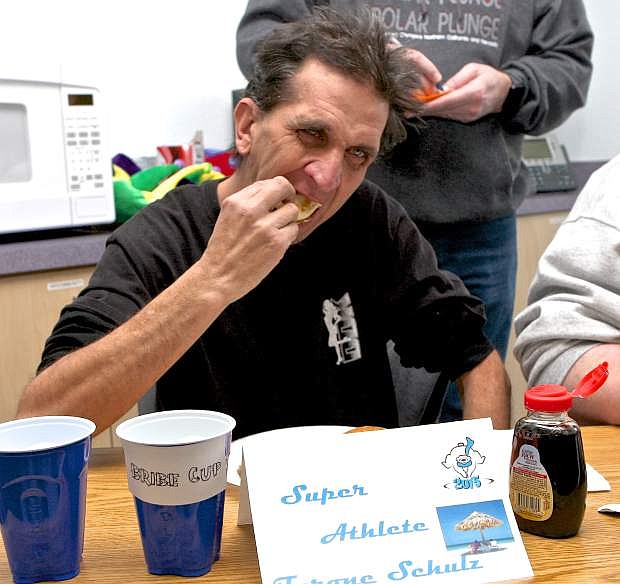Special Olympian Tyrone Schultz gobbles down pancakes in a contest at Greater Nevada Mortgage Thursday. The event raises funds and awareness for the Special Olympics Nevada Polar Plunge at Lake Tahoe, scheduled for March 21.