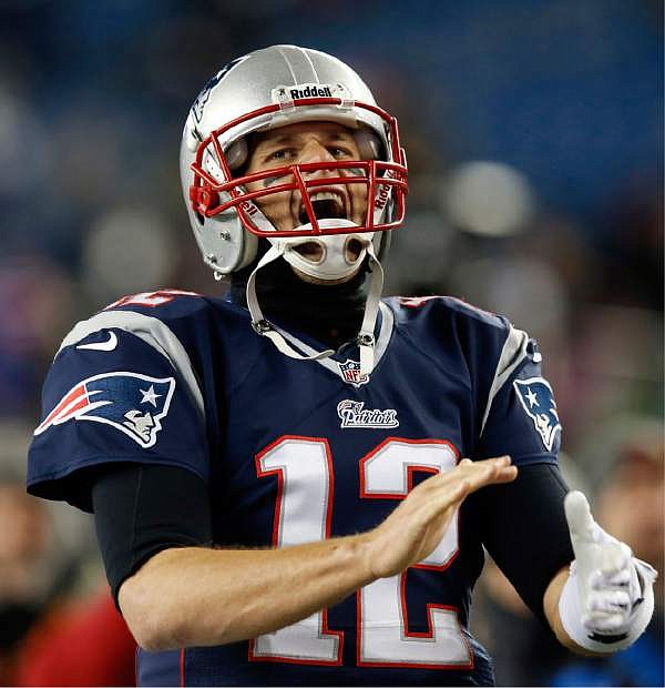 ADVANCE FOR WEEKEND EDITIONS, NOV. 30-DEC. 1 - FILE - In this Nov. 24, 2013, file photo, New England Patriots quarterback Tom Brady shouts as he runs on the field for an NFL football game against the Denver Broncos in Foxborough, Mass. For a quarterback who stays cool under pressure,  Brady sure gets worked up sometimes. (AP Photo/Elise Amendola, File)