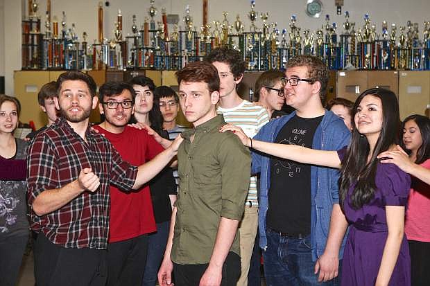 Pippin (Henry Wilson) is surrounded by other cast members at play rehearsal Wednesday at CHS. The Tony Award winning musical will be performed by Carson High students March 20th and 21st at the Carson City Community Center.
